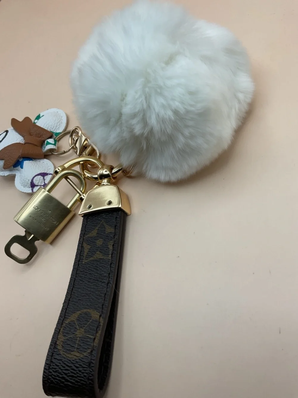 Monogram Leather Strap Keychain with Louis Vuitton Gold Lock and White Pom Pom - Picture 5 of 5